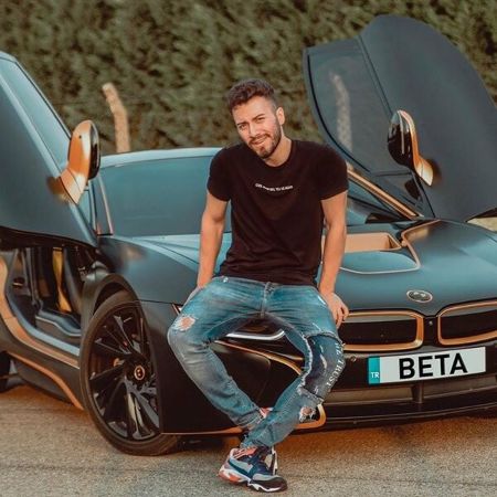 He is posing for a picture.